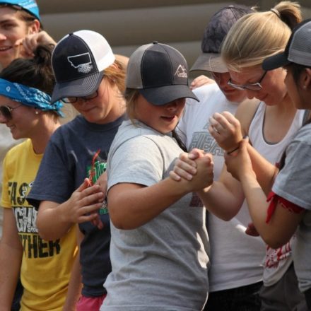 Students shaking hands at camp