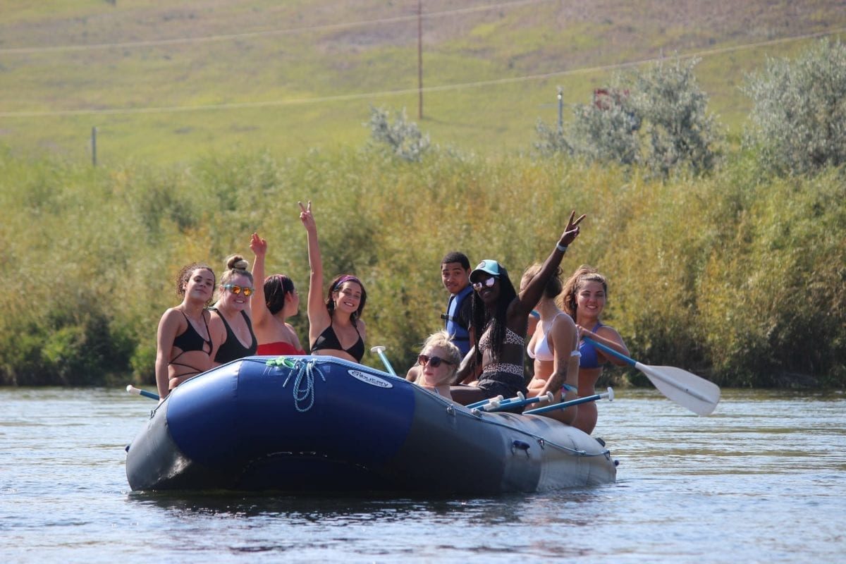 Students rafting along the river