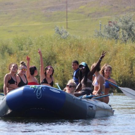 Students rafting along the river