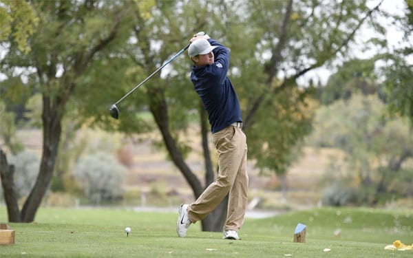 Student playing golf