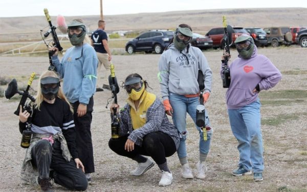 Students posing with their paintball guns