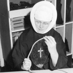 Sister Mary Morin Trinitas working with stained glass