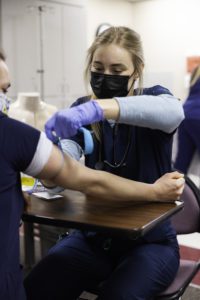 Nursing student practices taking blood